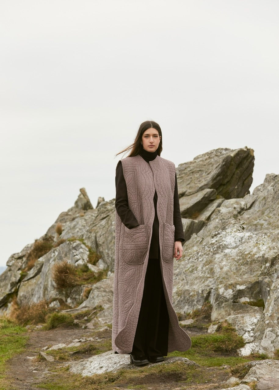 Sur veste longue sans manche matelassé