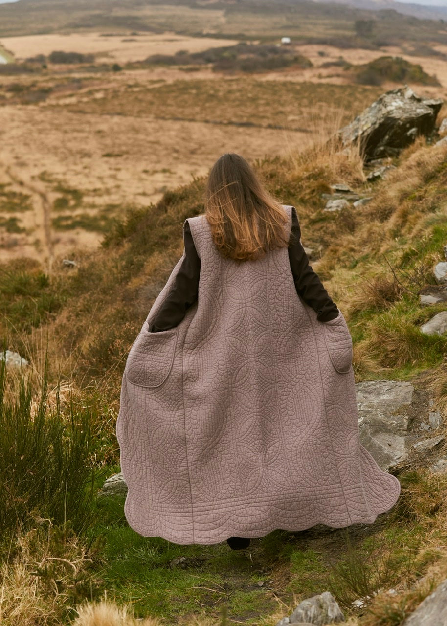 Sur veste longue sans manche matelassé